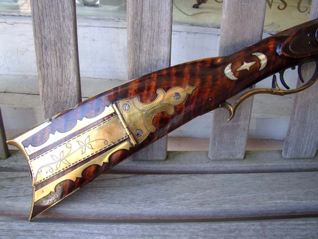 A Kentucky rifle in original percussion by Adam Daniels of Snyder County, PA., circa 1845